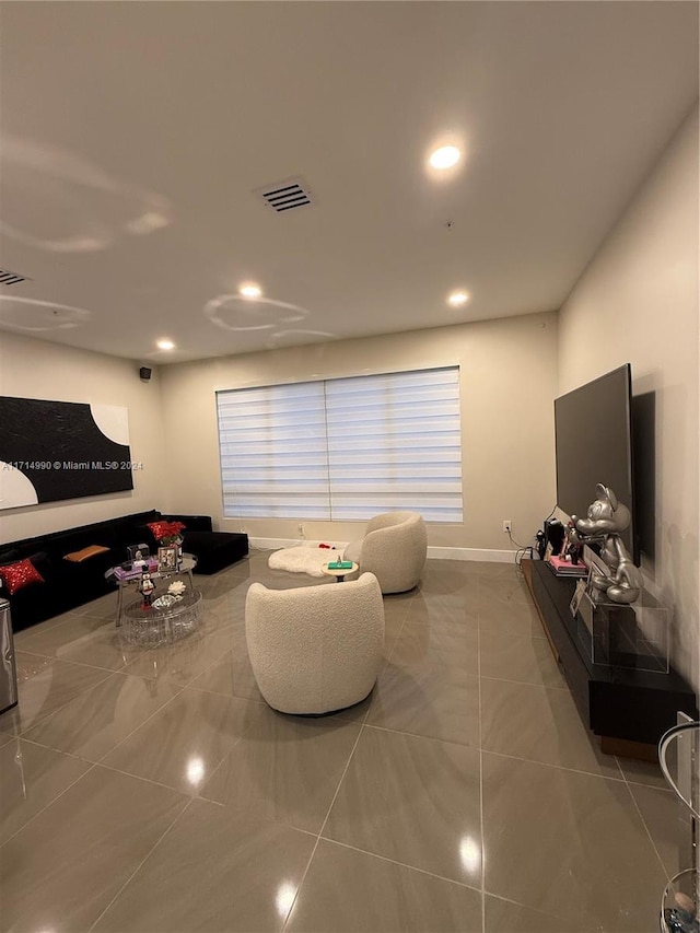 living room with tile patterned flooring