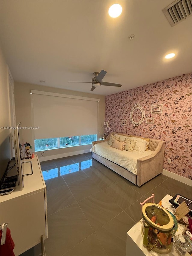 living room with dark tile patterned flooring and ceiling fan