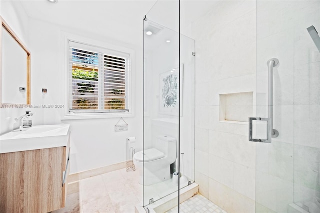 bathroom featuring walk in shower, vanity, and toilet