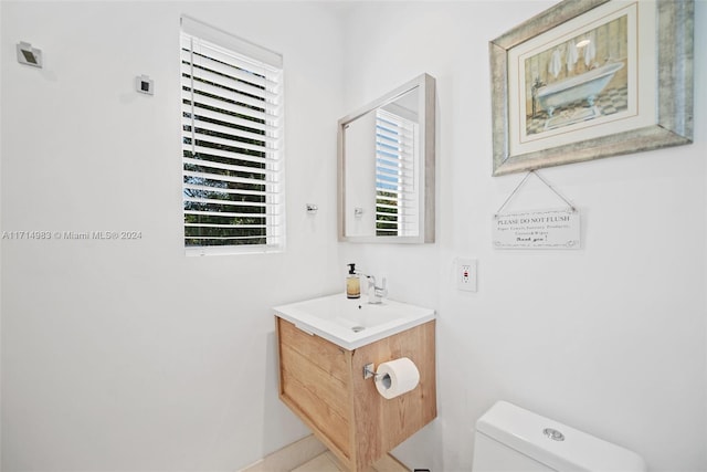 bathroom featuring vanity and toilet