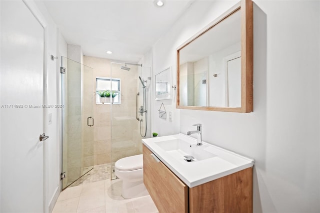 bathroom with walk in shower, tile patterned flooring, vanity, and toilet