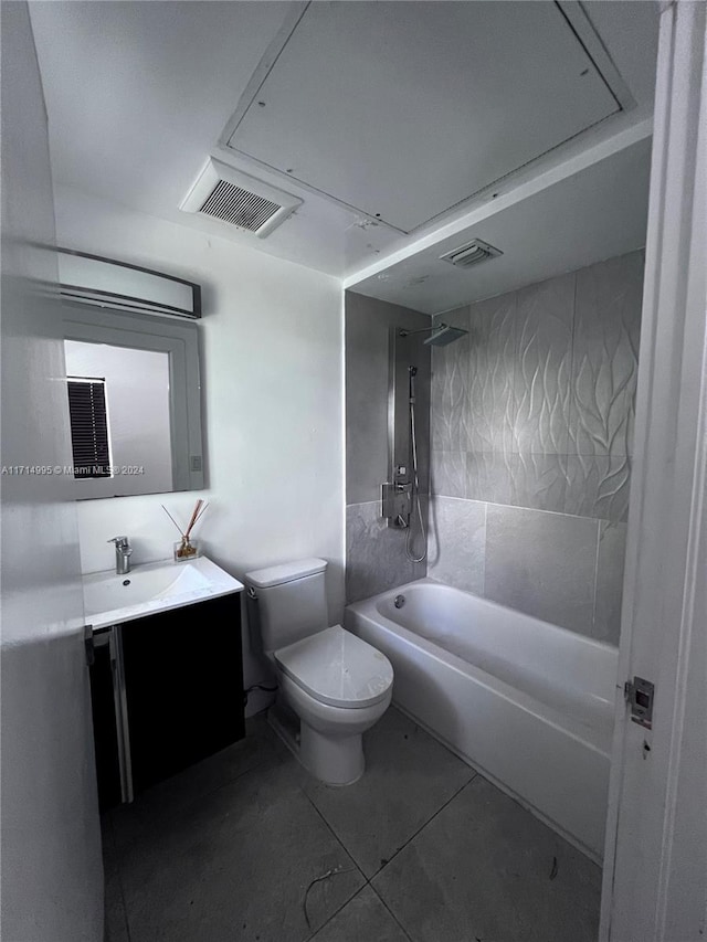 full bathroom featuring tile patterned flooring, vanity, toilet, and tub / shower combination