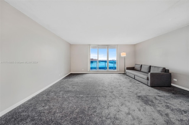 unfurnished living room featuring carpet flooring