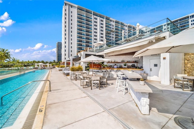 view of swimming pool featuring a patio area