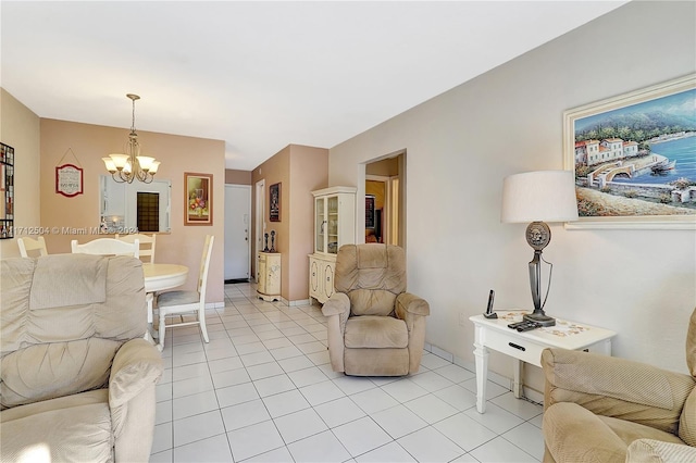 tiled living room with a notable chandelier