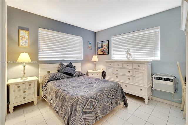 tiled bedroom with a wall mounted AC