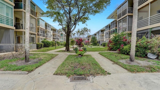 view of home's community featuring a yard