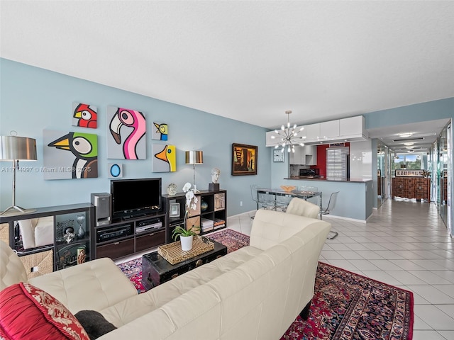 living room featuring light tile patterned floors and a notable chandelier