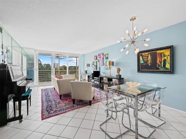 tiled living room with a chandelier, a textured ceiling, and expansive windows