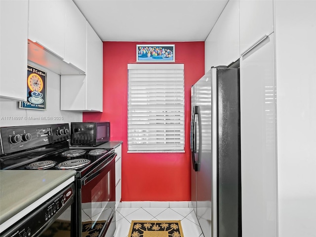 kitchen featuring black appliances, white cabinets, and light tile patterned floors