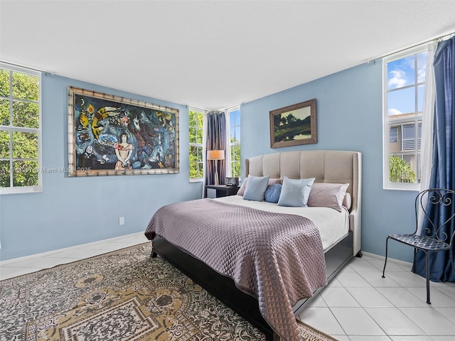 bedroom with light tile patterned floors