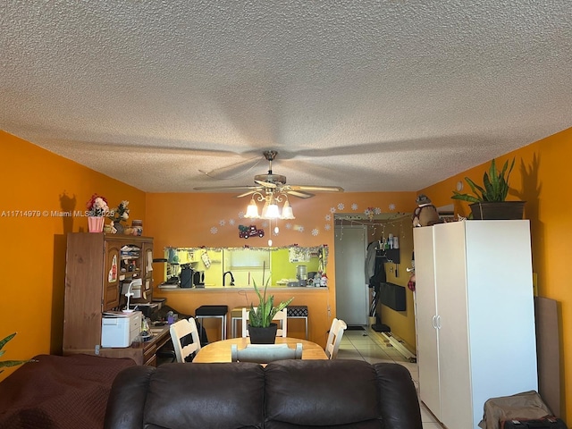 living room with a textured ceiling and a ceiling fan