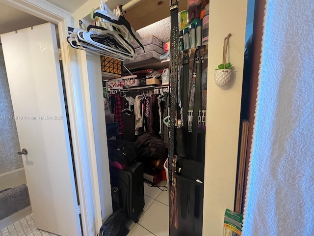 walk in closet featuring tile patterned flooring