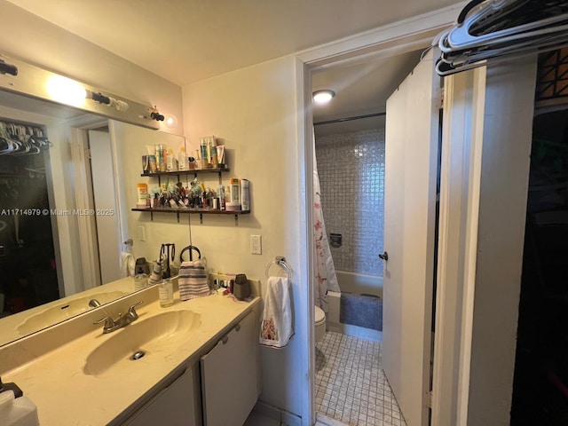 bathroom with tile patterned floors, toilet, vanity, and shower / bath combination with curtain