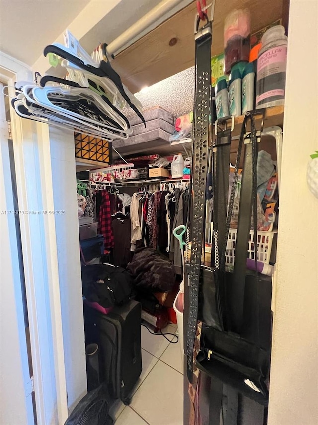 spacious closet with tile patterned floors