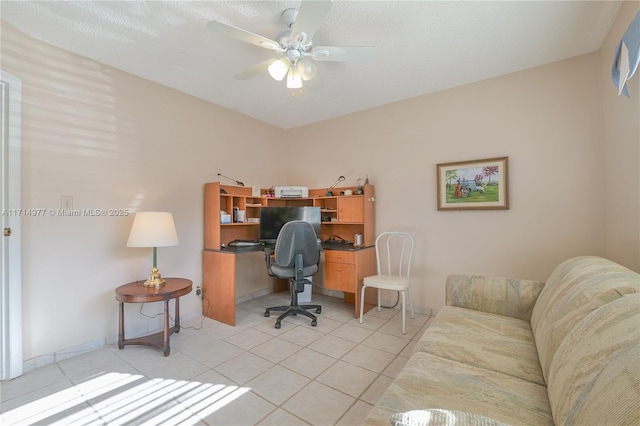 office featuring light tile patterned floors and ceiling fan