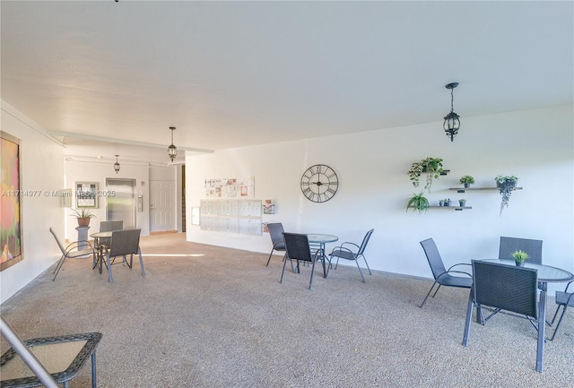 dining space featuring carpet flooring