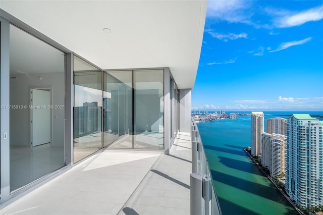 balcony featuring a water view