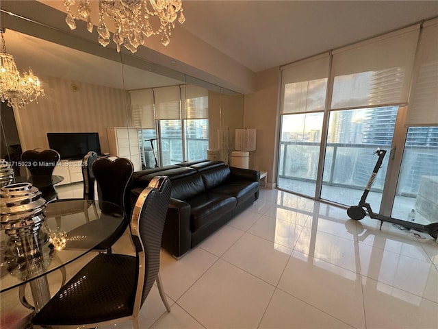 living room featuring expansive windows, tile patterned floors, plenty of natural light, and a chandelier