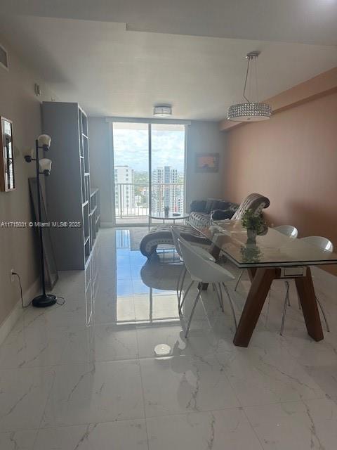 1250 S Miami Ave Unit 2013, Miami, FL 33130 - dining area with marble finish floors and floor to ceiling windows