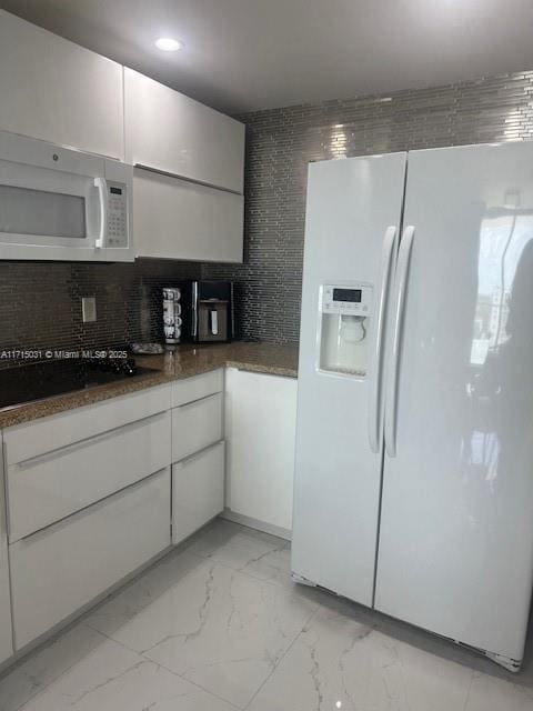 1250 S Miami Ave Unit 2013, Miami, FL 33130 - kitchen featuring white appliances, light marble finish floors, backsplash, dark countertops, and recessed lighting