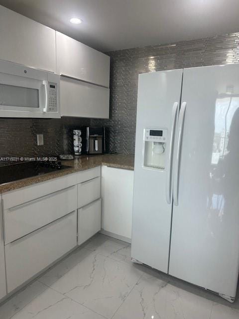 1250 S Miami Ave Unit 2013, Miami, FL 33130 - kitchen with white appliances, light marble finish flooring, tasteful backsplash, white cabinetry, and recessed lighting