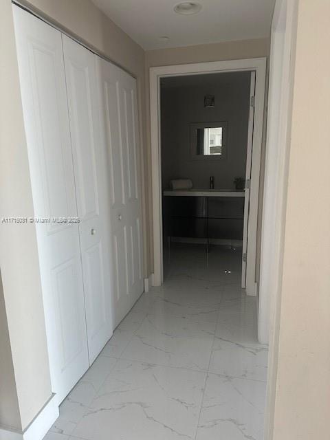 1250 S Miami Ave Unit 2013, Miami, FL 33130 - hallway featuring light marble finish floors