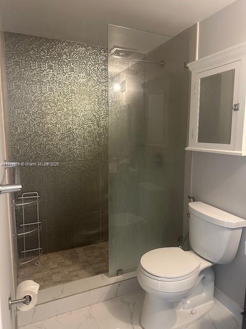 1250 S Miami Ave Unit 2013, Miami, FL 33130 - bathroom with tiled shower and marble look tiles