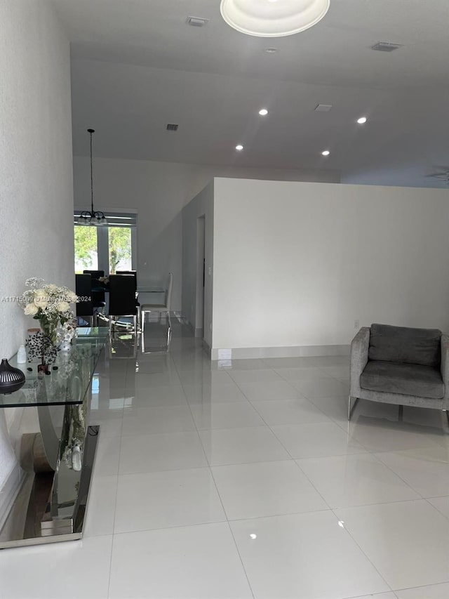 hall with light tile patterned floors