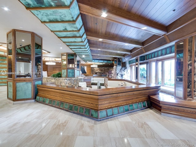 miscellaneous room with beam ceiling and wood ceiling