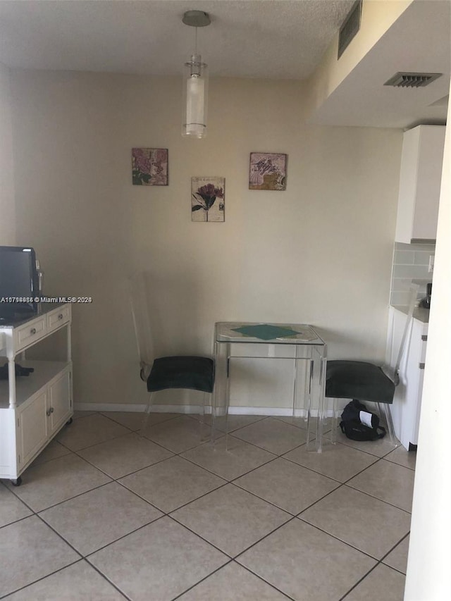 interior space featuring light tile patterned floors