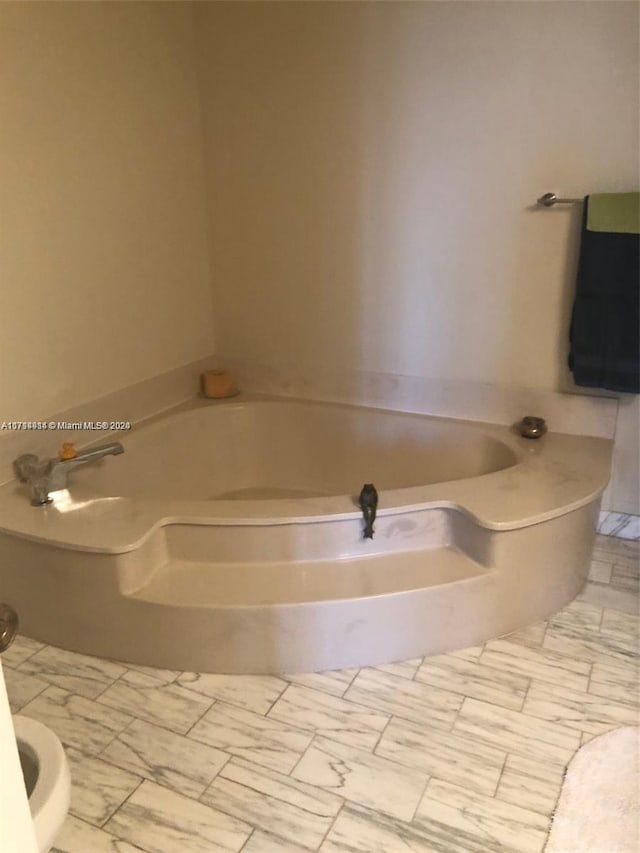 bathroom with a tub