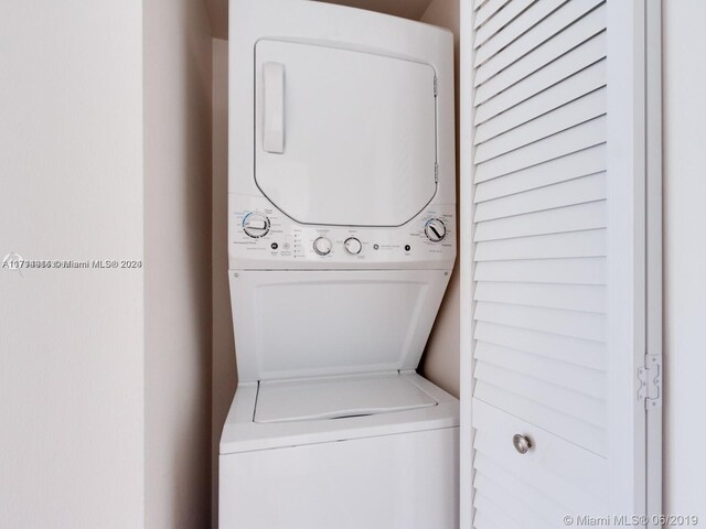 2000 Towerside Ter Unit 905, Miami, FL 33138 - laundry room with stacked washing machine and dryer