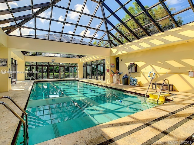 view of pool with a patio and a lanai