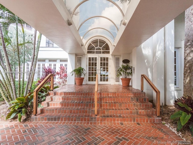 2000 Towerside Ter Unit 905, Miami, FL 33138 - doorway to property with french doors and stucco siding