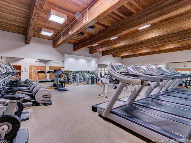 gym with wooden ceiling and a towering ceiling