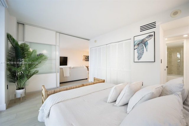 bedroom featuring a closet and light hardwood / wood-style flooring