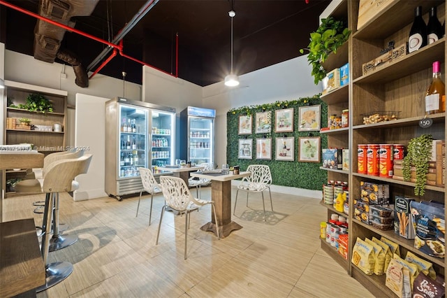 dining room featuring a towering ceiling