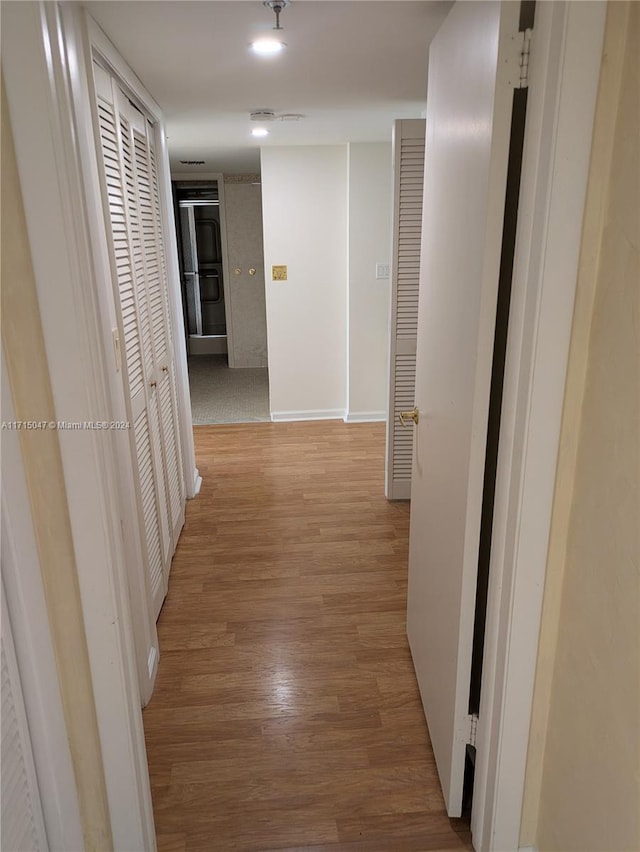 hall featuring light hardwood / wood-style flooring