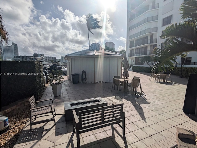 view of patio / terrace with an outdoor fire pit