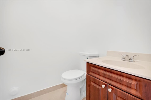 bathroom featuring toilet and vanity