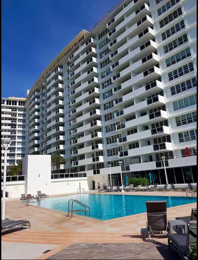 view of swimming pool featuring a patio area