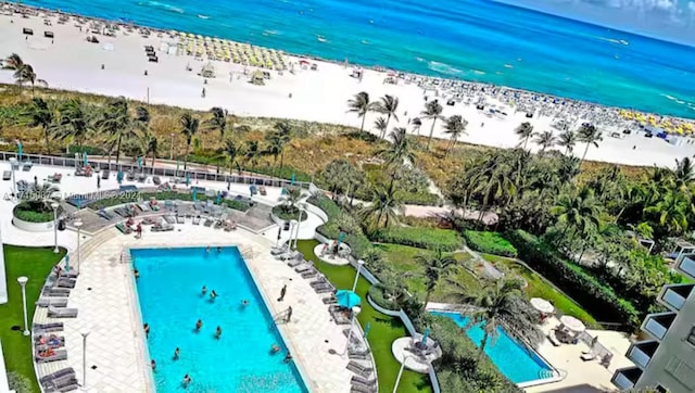 bird's eye view featuring a water view and a view of the beach