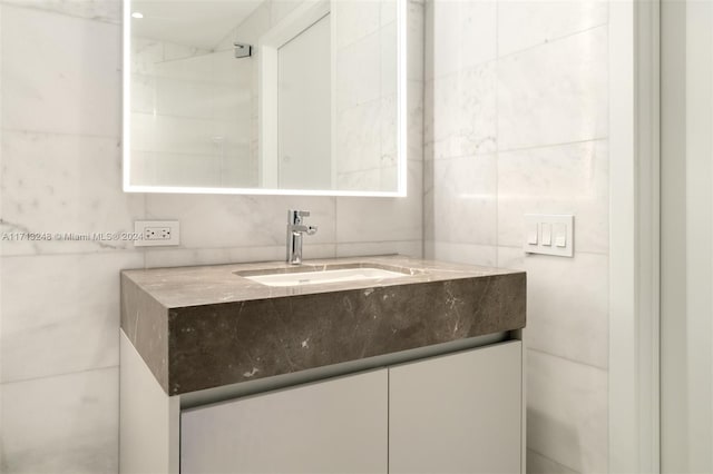 500 Alton Rd Unit 2207, Miami Beach, FL 33139 - bathroom featuring tile walls and vanity