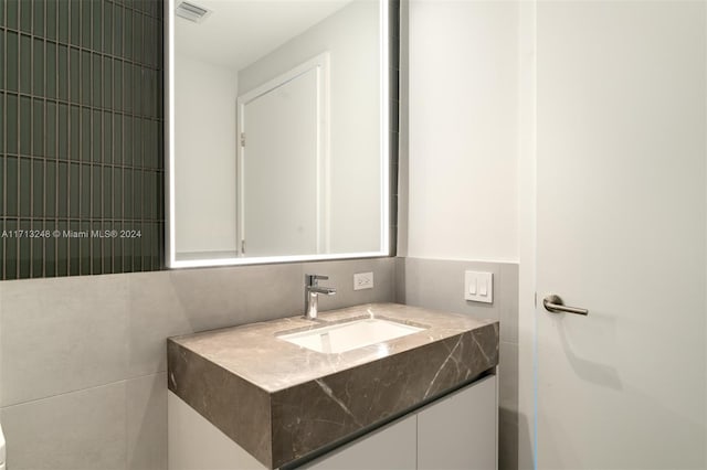 500 Alton Rd Unit 2207, Miami Beach, FL 33139 - bathroom with vanity and tile walls