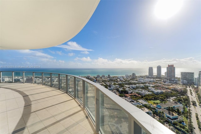 balcony featuring a water view