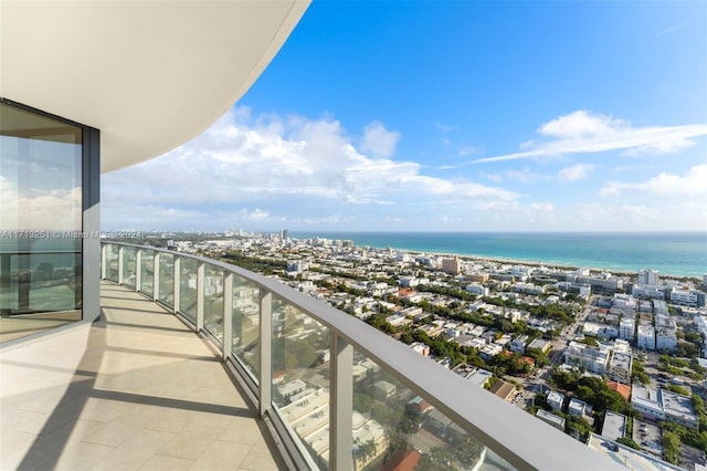 balcony featuring a water view