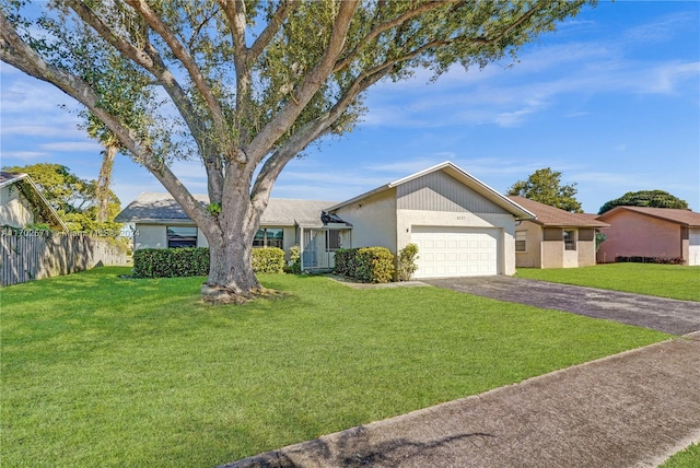 single story home featuring a garage and a front lawn