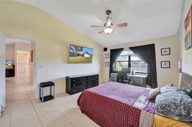 bedroom featuring ceiling fan, light tile patterned flooring, and vaulted ceiling