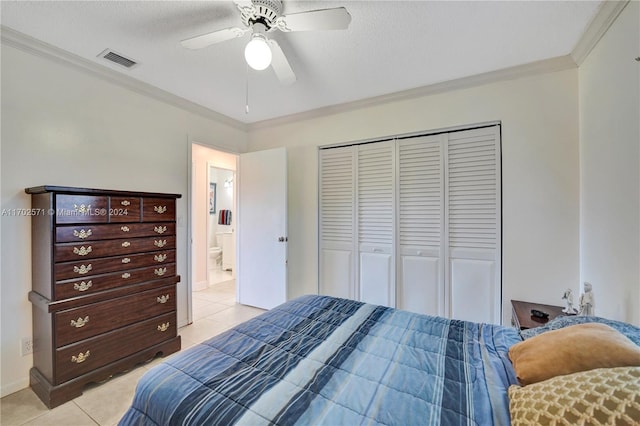 tiled bedroom with ceiling fan, a closet, crown molding, and a textured ceiling